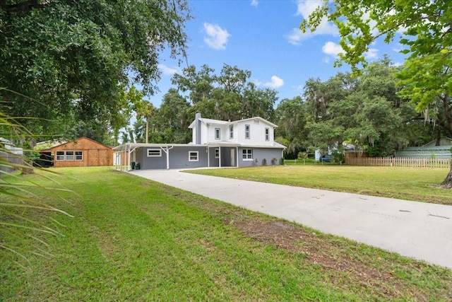 2005 Sunny Ln, New Smyrna Beach, FL 32168 - view of front of house featuring concrete driveway and view of wooded area