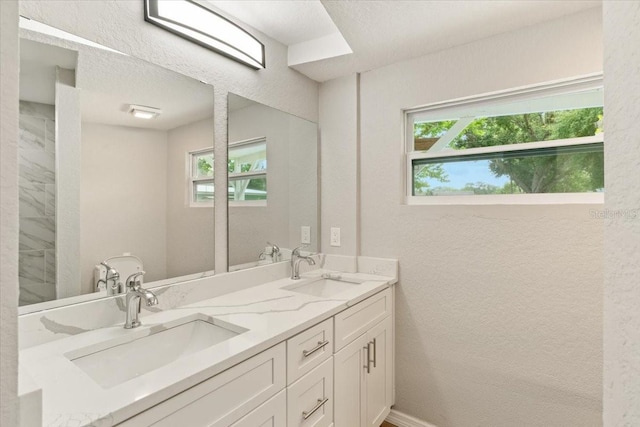 2005 Sunny Ln, New Smyrna Beach, FL 32168 - full bathroom with double vanity and a textured wall