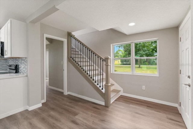 2005 Sunny Ln, New Smyrna Beach, FL 32168 - foyer featuring stairs, light wood-type flooring, and recessed lighting