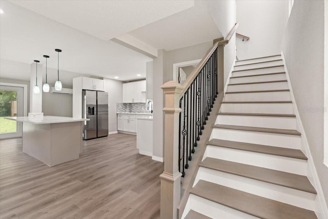 2005 Sunny Ln, New Smyrna Beach, FL 32168 - staircase with wood finished floors and recessed lighting
