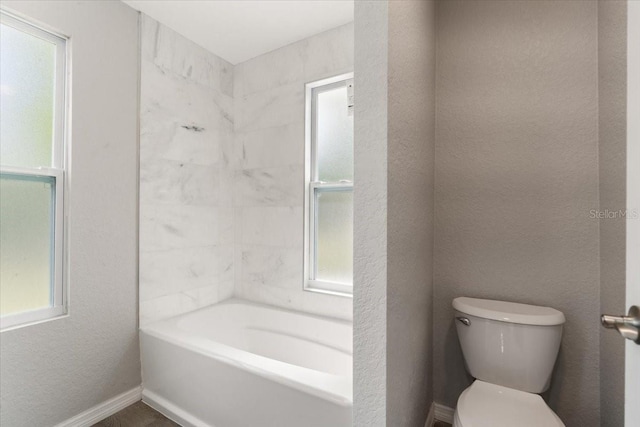 2005 Sunny Ln, New Smyrna Beach, FL 32168 - bathroom featuring toilet and a tub to relax in