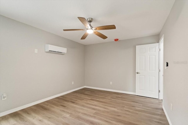 2005 Sunny Ln, New Smyrna Beach, FL 32168 - empty room featuring an AC wall unit, a ceiling fan, and light wood-style flooring