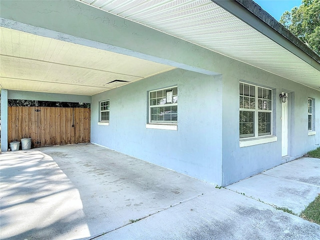 3045 Pine Tree Dr, Edgewater, FL 32141 - view of patio with an attached carport