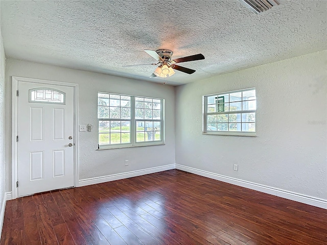 3045 Pine Tree Dr, Edgewater, FL 32141 - entryway featuring a textured ceiling, ceiling fan, a textured wall, and wood-type flooring