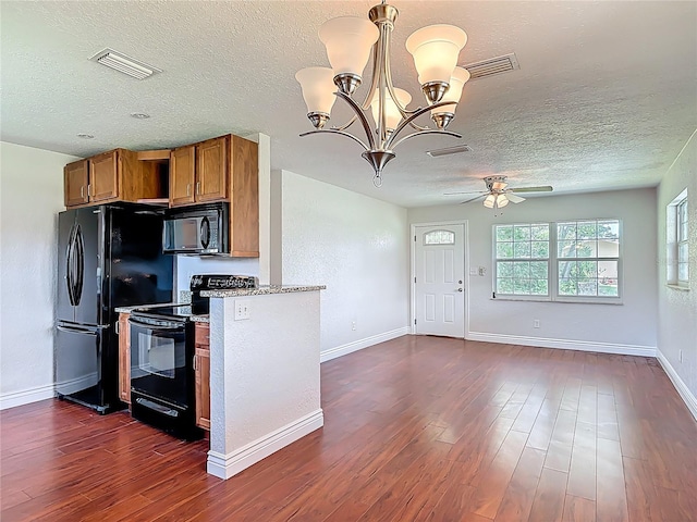 3045 Pine Tree Dr, Edgewater, FL 32141 - kitchen featuring black appliances, brown cabinets, a textured ceiling, a ceiling fan, and dark wood-style flooring