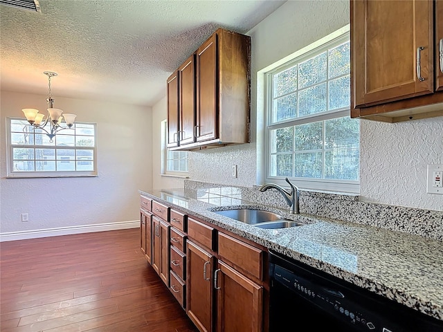 3045 Pine Tree Dr, Edgewater, FL 32141 - kitchen with black dishwasher, dark wood-style floors, a chandelier, healthy amount of natural light, and a textured ceiling