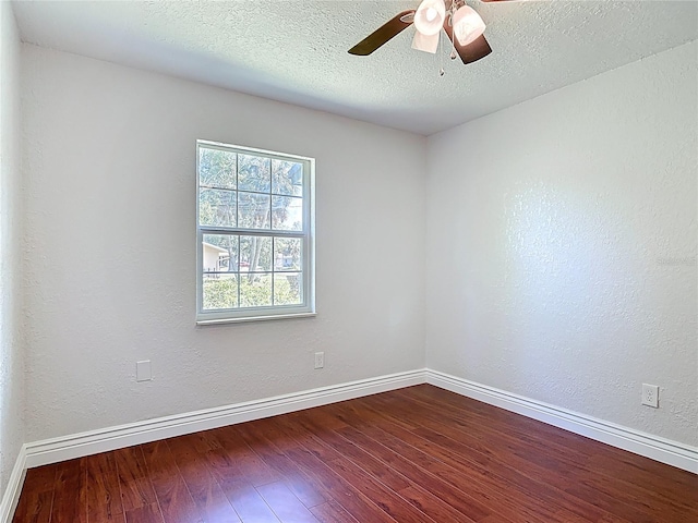 3045 Pine Tree Dr, Edgewater, FL 32141 - unfurnished room with dark wood-style floors and ceiling fan