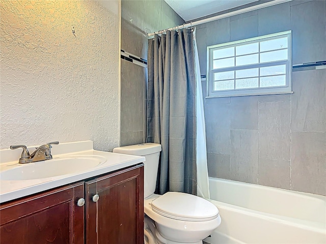 3045 Pine Tree Dr, Edgewater, FL 32141 - bathroom with a textured wall, vanity, and shower / tub combo