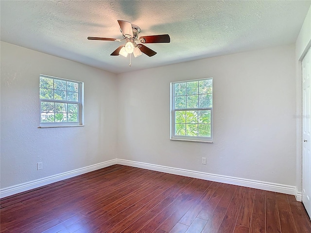 3045 Pine Tree Dr, Edgewater, FL 32141 - spare room with healthy amount of natural light, hardwood / wood-style floors, a ceiling fan, and a textured ceiling