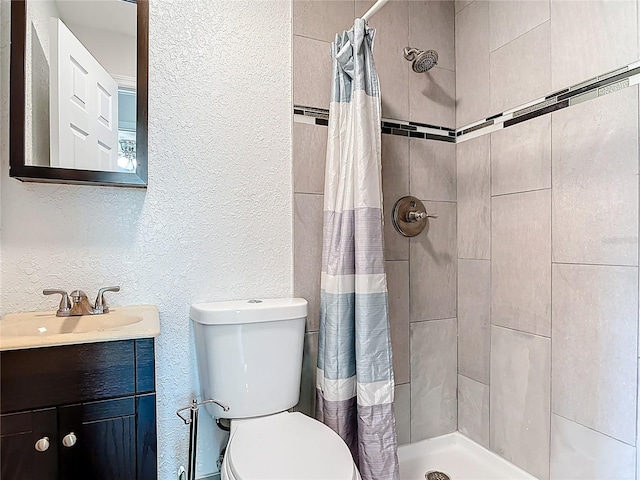 3045 Pine Tree Dr, Edgewater, FL 32141 - full bath with a textured wall, vanity, and tiled shower