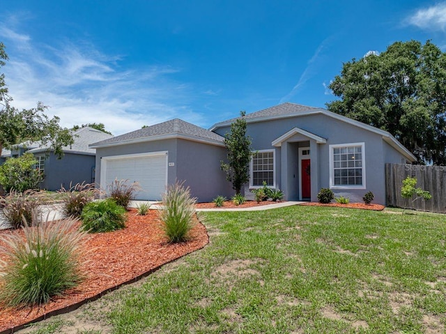 411 Ryans Ridge Ave, Eustis, FL 32726 - ranch-style home with stucco siding and an attached garage