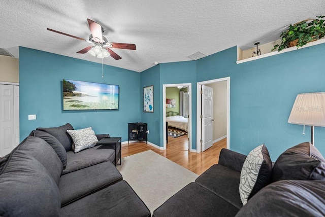 411 Ryans Ridge Ave, Eustis, FL 32726 - living room featuring wood finished floors, a ceiling fan, and a textured ceiling