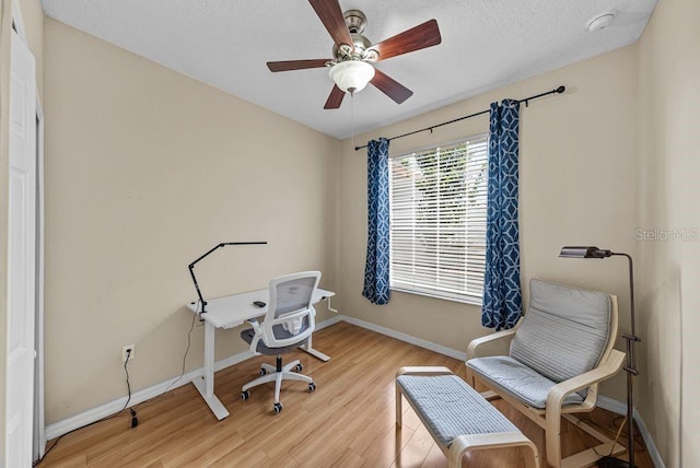 411 Ryans Ridge Ave, Eustis, FL 32726 - office featuring light wood-style flooring, a ceiling fan, and a textured ceiling