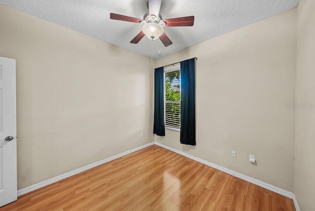411 Ryans Ridge Ave, Eustis, FL 32726 - unfurnished room with wood finished floors, ceiling fan, and a textured ceiling