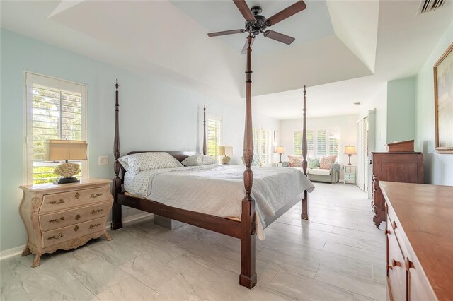 904 Clubhouse Blvd, New Smyrna Beach, FL 32168 - bedroom with a ceiling fan and baseboards