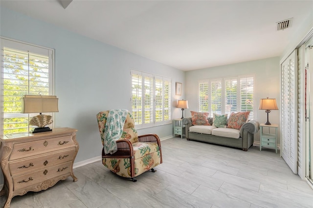 904 Clubhouse Blvd, New Smyrna Beach, FL 32168 - living area featuring healthy amount of natural light