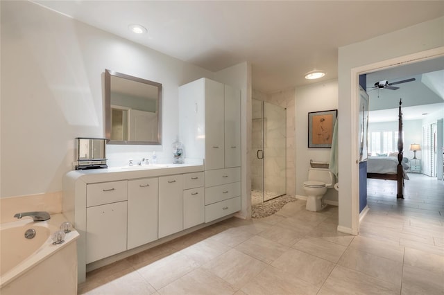 904 Clubhouse Blvd, New Smyrna Beach, FL 32168 - ensuite bathroom featuring a stall shower, ceiling fan, vanity, a bath, and tile patterned floors