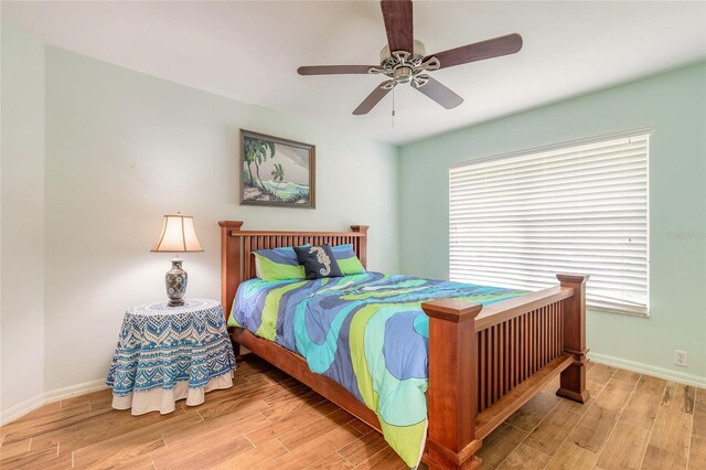 904 Clubhouse Blvd, New Smyrna Beach, FL 32168 - bedroom featuring wood finished floors and a ceiling fan