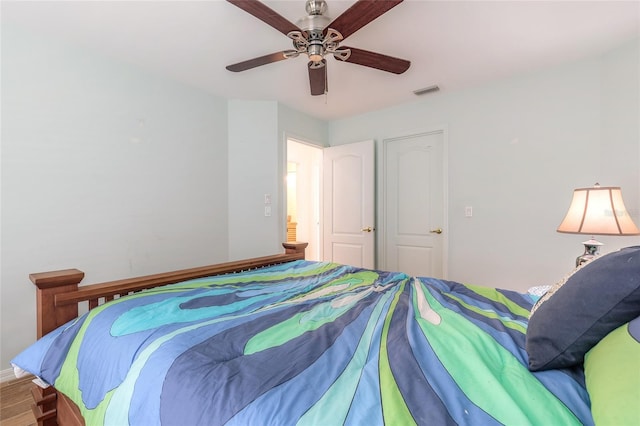 904 Clubhouse Blvd, New Smyrna Beach, FL 32168 - bedroom with ceiling fan and wood finished floors