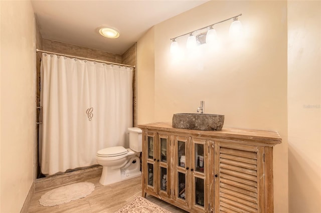 904 Clubhouse Blvd, New Smyrna Beach, FL 32168 - full bath with a shower with shower curtain, wood finished floors, and vanity