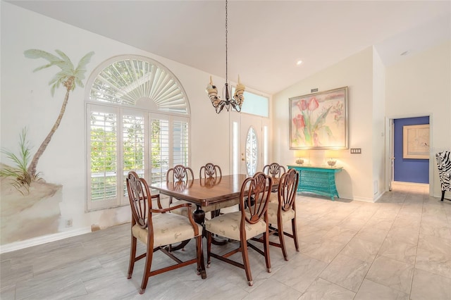 904 Clubhouse Blvd, New Smyrna Beach, FL 32168 - dining area featuring a chandelier and high vaulted ceiling