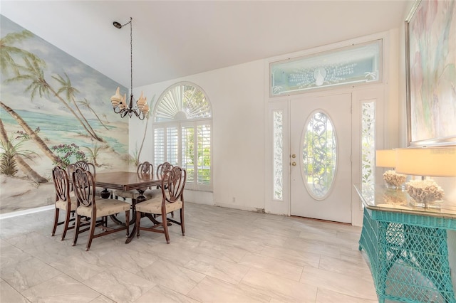 904 Clubhouse Blvd, New Smyrna Beach, FL 32168 - dining area with healthy amount of natural light, a chandelier, and high vaulted ceiling