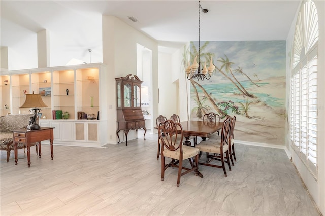 904 Clubhouse Blvd, New Smyrna Beach, FL 32168 - dining room with a chandelier and a towering ceiling