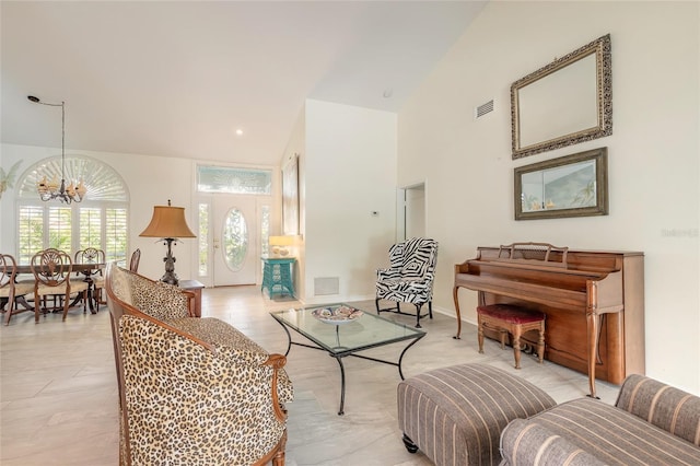 904 Clubhouse Blvd, New Smyrna Beach, FL 32168 - living room featuring high vaulted ceiling and a chandelier