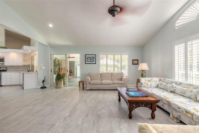 904 Clubhouse Blvd, New Smyrna Beach, FL 32168 - living room featuring ceiling fan and high vaulted ceiling