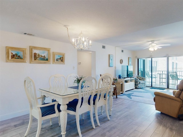 4175 S Atlantic Ave Unit 4110, New Smyrna Beach, FL 32169 - dining room with a chandelier, light wood-style floors, and a ceiling fan