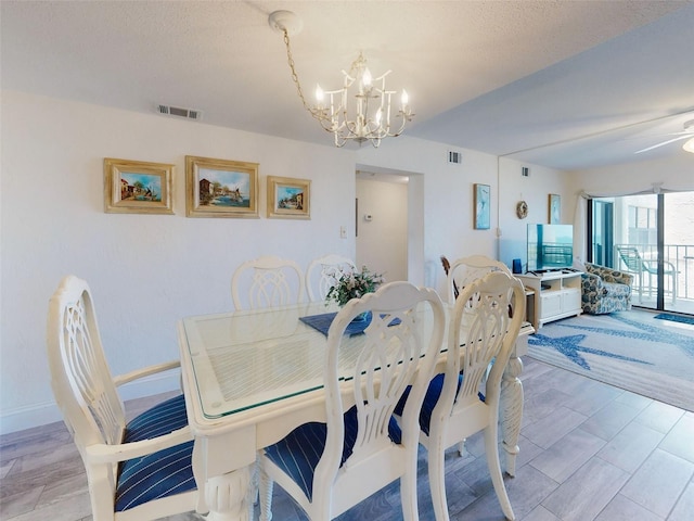4175 S Atlantic Ave Unit 4110, New Smyrna Beach, FL 32169 - dining area with a chandelier and baseboards