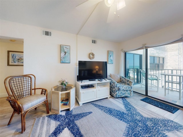 4175 S Atlantic Ave Unit 4110, New Smyrna Beach, FL 32169 - living area featuring wood finished floors, ceiling fan, and vaulted ceiling