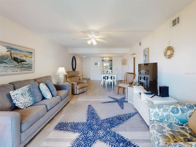 4175 S Atlantic Ave Unit 4110, New Smyrna Beach, FL 32169 - living area with ceiling fan and light wood-style flooring