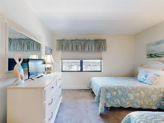 4175 S Atlantic Ave Unit 4110, New Smyrna Beach, FL 32169 - bedroom featuring carpet flooring and baseboards