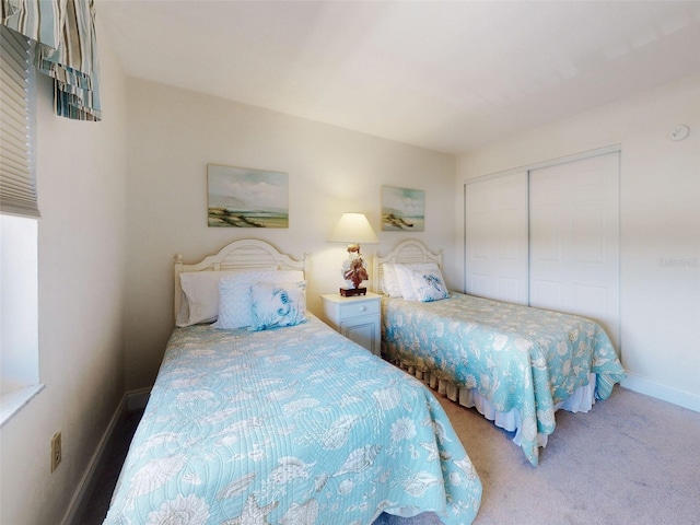 4175 S Atlantic Ave Unit 4110, New Smyrna Beach, FL 32169 - carpeted bedroom featuring a closet and baseboards