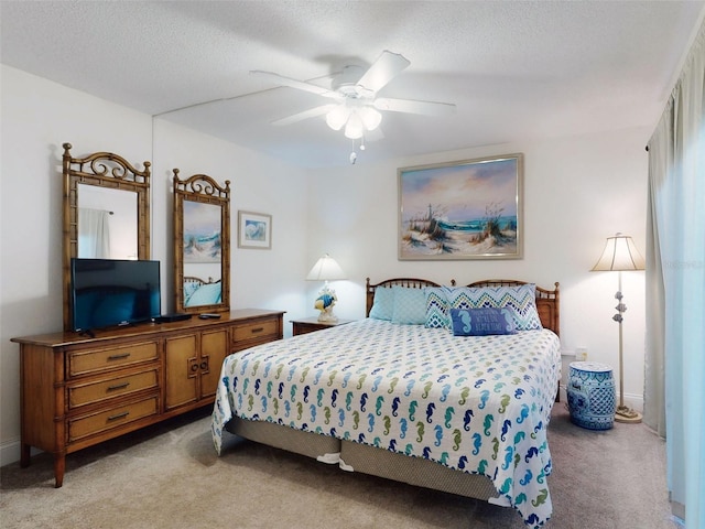 4175 S Atlantic Ave Unit 4110, New Smyrna Beach, FL 32169 - bedroom featuring light carpet, a textured ceiling, and ceiling fan