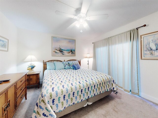 4175 S Atlantic Ave Unit 4110, New Smyrna Beach, FL 32169 - carpeted bedroom with baseboards and a ceiling fan