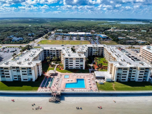 4175 S Atlantic Ave Unit 4110, New Smyrna Beach, FL 32169 - drone / aerial view of a pool and a large body of water