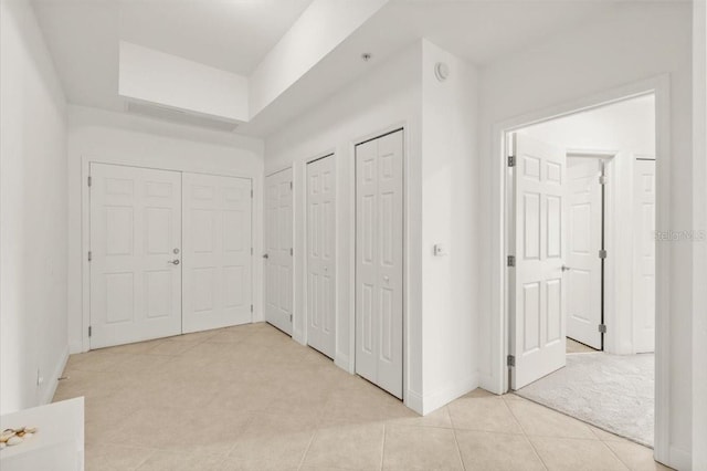 2 Oceans W Blvd Unit 206, Daytona Beach Shores, FL 32118 - hallway with light tile patterned floors and baseboards