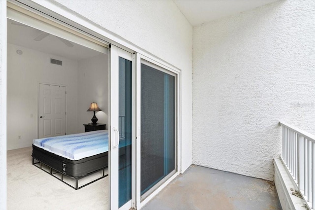 2 Oceans W Blvd Unit 206, Daytona Beach Shores, FL 32118 - bedroom with concrete flooring and a textured wall