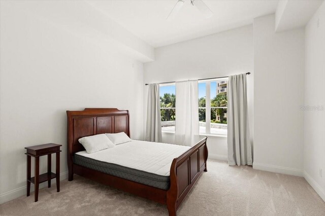 2 Oceans W Blvd Unit 206, Daytona Beach Shores, FL 32118 - bedroom with light colored carpet and ceiling fan