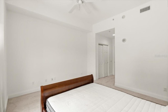 2 Oceans W Blvd Unit 206, Daytona Beach Shores, FL 32118 - carpeted bedroom featuring ceiling fan and a closet