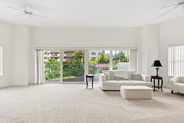 2 Oceans W Blvd Unit 206, Daytona Beach Shores, FL 32118 - living room featuring ceiling fan and carpet flooring