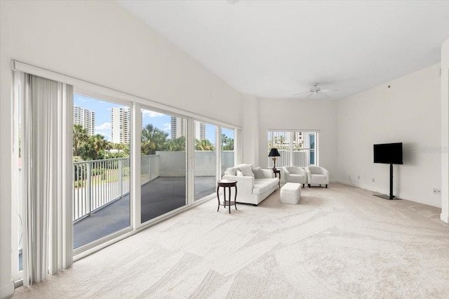 2 Oceans W Blvd Unit 206, Daytona Beach Shores, FL 32118 - living area featuring carpet floors and a ceiling fan