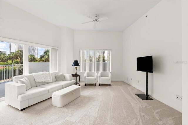 2 Oceans W Blvd Unit 206, Daytona Beach Shores, FL 32118 - carpeted living area featuring healthy amount of natural light and ceiling fan