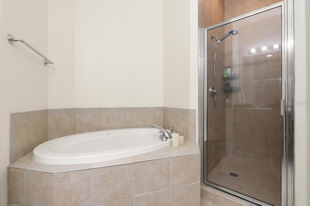 2 Oceans W Blvd Unit 206, Daytona Beach Shores, FL 32118 - bathroom with a bath and a shower stall