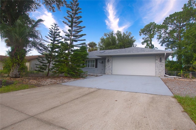 2548 Crestwood Ave, New Smyrna Beach, FL 32168 - view of front of house with concrete driveway, an attached garage, and brick siding