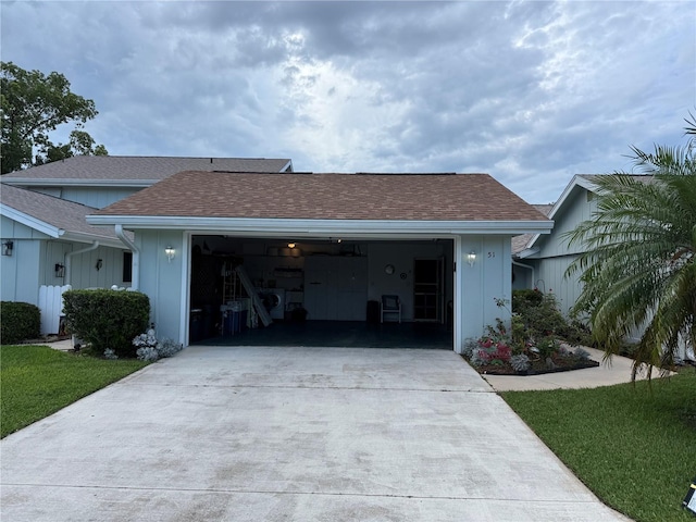 51 Fore Dr, New Smyrna Beach, FL 32168 - view of front of home featuring concrete driveway, a garage, and roof with shingles