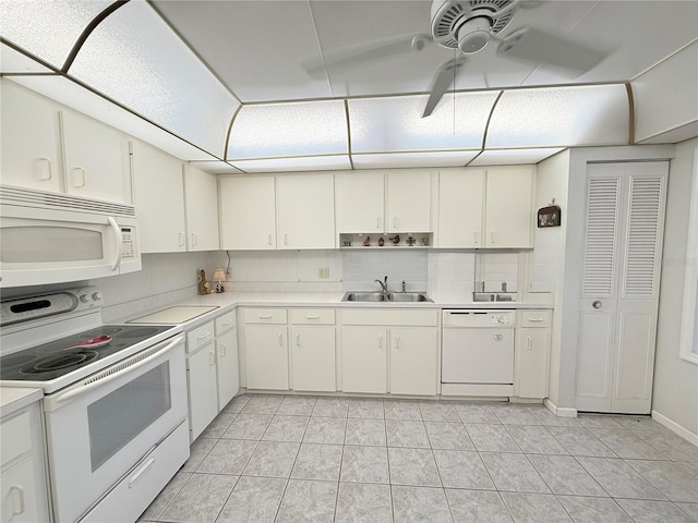 51 Fore Dr, New Smyrna Beach, FL 32168 - kitchen featuring white appliances, light countertops, ceiling fan, light tile patterned floors, and backsplash