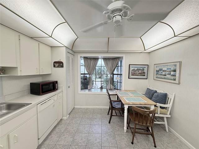 51 Fore Dr, New Smyrna Beach, FL 32168 - dining room featuring ceiling fan and light tile patterned flooring